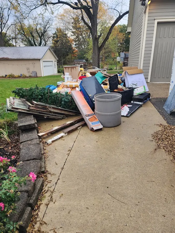 Dumpster being loaded with debris for 12 Yard Dumpster Rental in Chester